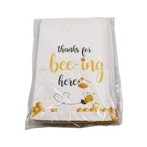 Bee-themed party favor bags with sunflower design and thanks for bee-ing here text