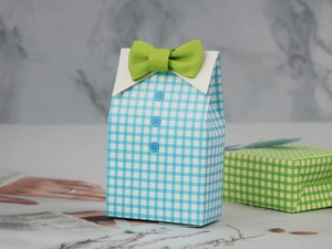 Detail of shirt-style candy box featuring blue plaid pattern and green ribbon bowtie