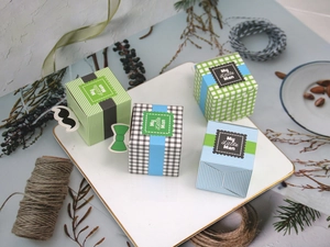 Detail of creative My Little Man candy boxes with bow tie and mustache paper tags