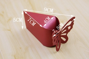 Detail view of small red candy box with laser-cut butterfly and detailed size dimensions