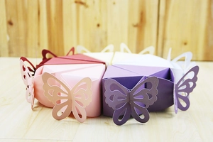 Macro view of laser-cut butterfly hollow pattern on candy box for weddings