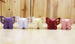 Detailed laser-cut butterfly candy boxes in purple white yellow red and pink colors