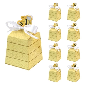 Yellow beehive pattern trapezoid favor boxes with white satin bows and bee toppers