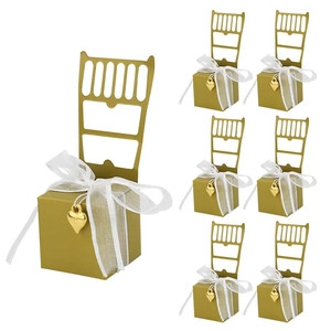 Elegant gold chair-shaped gift boxes with white organza ribbons and heart charms