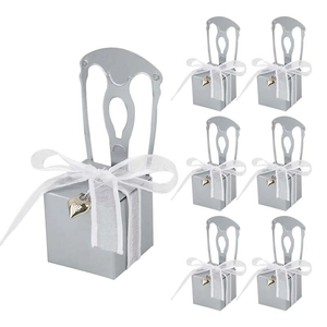 Silver chair-shaped candy gift boxes with white organza ribbons for wedding favors