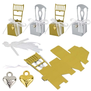 Elegant chair-shaped candy gift boxes in gold and silver for wedding favors with ribbons