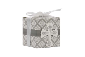 Close-up of European style wedding candy box with damask pattern and silver cross ribbon