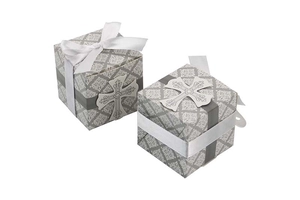 Detail of square wedding favor boxes with grey damascus pattern and white cross charm