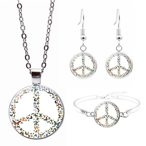 Three-piece jewelry set with silver chain and colorful butterfly peace sign glass dome pendants