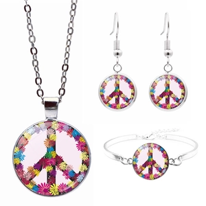 Silver peace sign jewelry set with colorful floral daisy pattern glass pendant