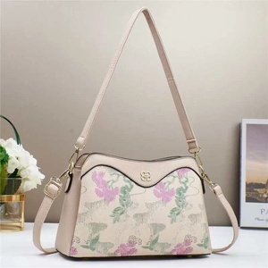 Beige floral embroidered crossbody bag with pebble leather texture and gold hardware