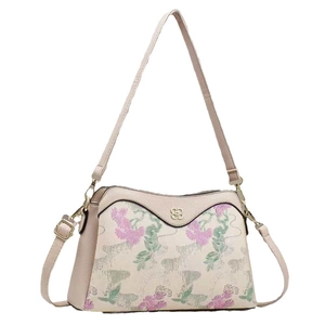 Elegant beige crossbody bag with floral embroidery and golden metal hardware details