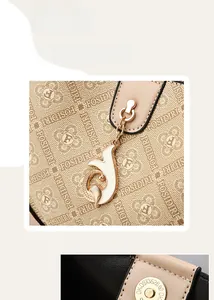 Detail of premium patterned leather texture with metallic logo charm and magnetic clasp