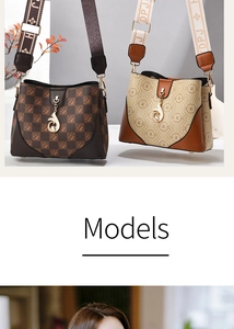 Detail of printed bucket bag with wide shoulder strap and metal zipper hardware