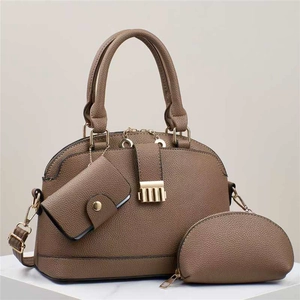 Three-piece tote bag set with pebble leather texture and gold hardware in coffee brown