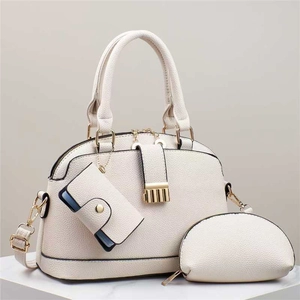 White three-piece tote set with lychee grain leather and elegant gold hardware