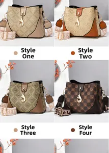 Detail view of four printed bucket bags with fox charms and stylish wide straps