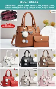 Detail of stone pattern composite leather tote bag with round metal buckle and fur pompom