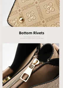 Detail of metal bottom rivets and secure gold zipper on printed fashion tote bag