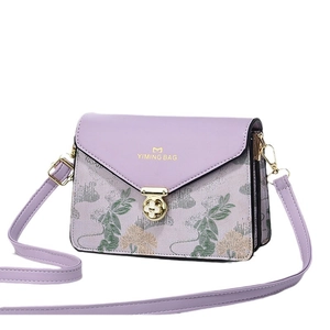 Purple embroidered crossbody bag with floral pattern and golden twist lock closure