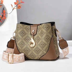 Vintage spliced printed bucket bag with wide shoulder strap and gold fox pendant charm