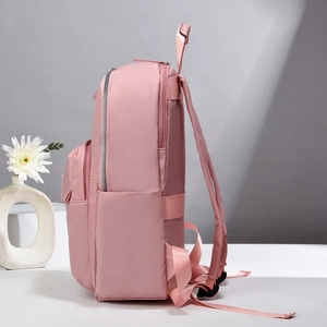 Side view of pink lightweight laptop backpack with dual zippers and water bottle pocket