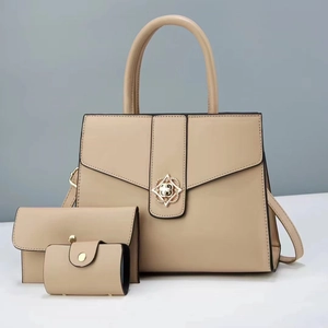 Three-piece beige faux leather handbag set with large tote, clutch and card holder