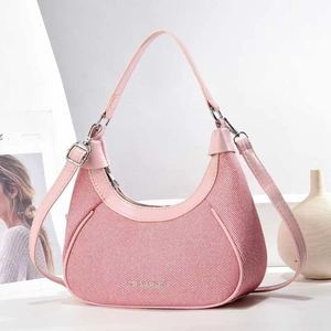 Pink woven crescent hobo bag with leather handles and adjustable shoulder strap