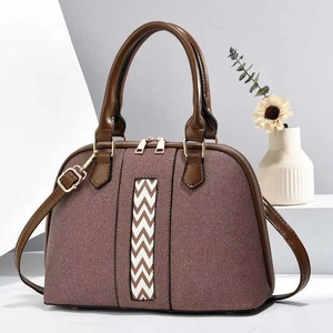 Chic two-tone canvas tote bag with pink and brown paneling and a wavy stripe detail