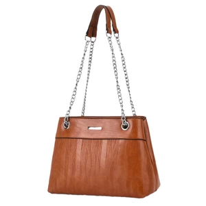 Brown striped shoulder bag with silver chain strap and wavy textured pattern