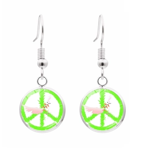 Detail of silver drop earrings with peace sign and dove motif on white background