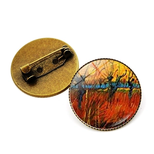 Vue détaillée avant et arrière d'une broche en bronze avec peinture à l'huile de Van Gogh