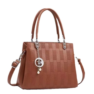 Elegant brown embossed leather handbag for women with metallic moon star pendant detail
