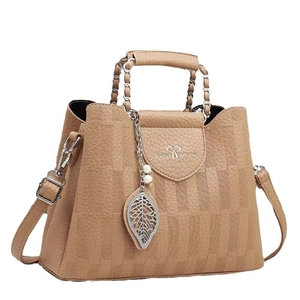 Brown woven plaid bucket bag with metallic leaf charm and pearl accents for women