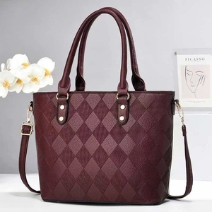 Elegant wine red quilted bucket bag with gold studs and detachable shoulder strap