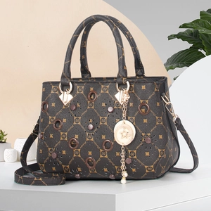 Vintage black and coffee monogram tote bag with laser-cut floral details and strap