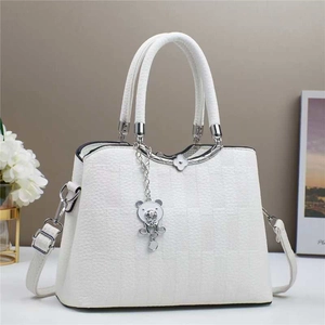 White checkered crossbody bag for women with bear pendant and silver trim accents
