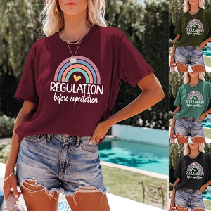 Detail of loose fit cotton T-shirt featuring rainbow print and typographic slogan