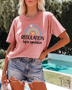 Detail of cotton T-shirt with rainbow and heart print featuring expectation text