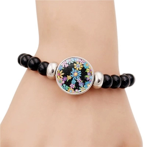 Handmade stretch beaded bracelet with peace sign and colorful daisy flower charm for men and women