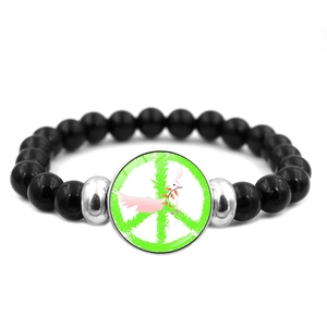 Elastic beaded bracelet with black beads and peace sign pendant on white background