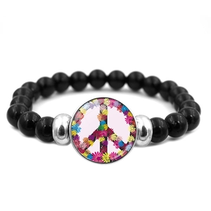 Elastic black beaded bracelet with colorful floral peace sign charm and silver spacers