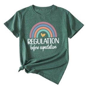 Detail of dark green t-shirt featuring rainbow print and regulation text design