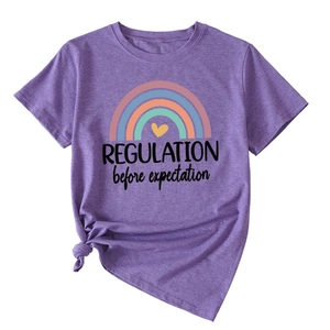 Detail of purple cotton T-shirt with rainbow print and stylish side knot design at hem