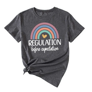 Detail of dark grey t-shirt showing colorful rainbow print and side knot design