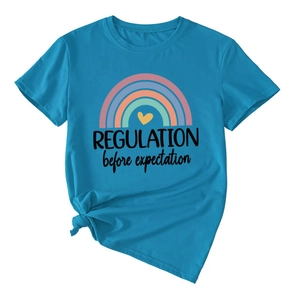 Detail of royal blue t-shirt with rainbow print and a knotted side hem design