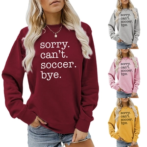 Detail view of long-sleeve soccer crewnecks in burgundy, gray, pink, and yellow