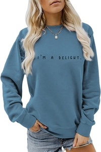 Close-up of I'M A DELIGHT text print on blue-grey crewneck sweatshirt fabric