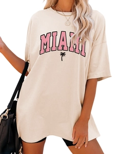 Close-up of Miami letter print and palm tree icon on beige oversized cotton T-shirt