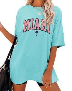 Detail of MIAMI text and palm tree print on light blue loose fit cotton t-shirt